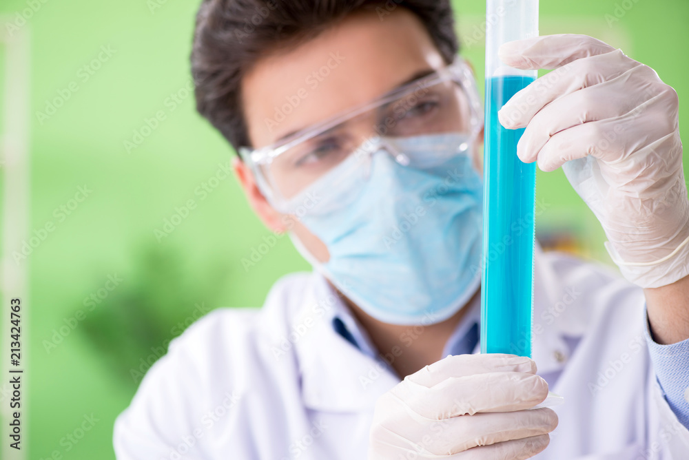 Man chemist working in the lab