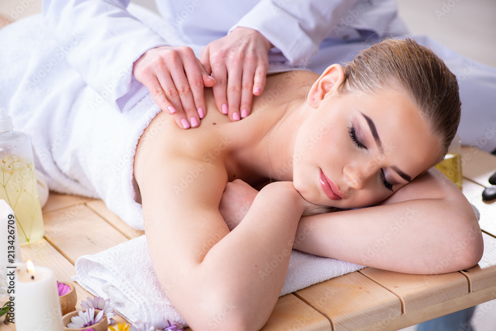 Woman during massage session in spa