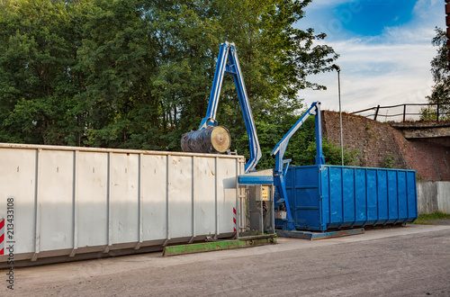 Recycling yard with press and containers