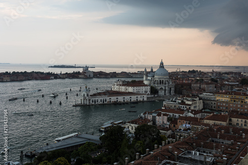 Threatening sky over the Grand Canal and the famous basilica di santa maria della salute in Venice old town in north italy.