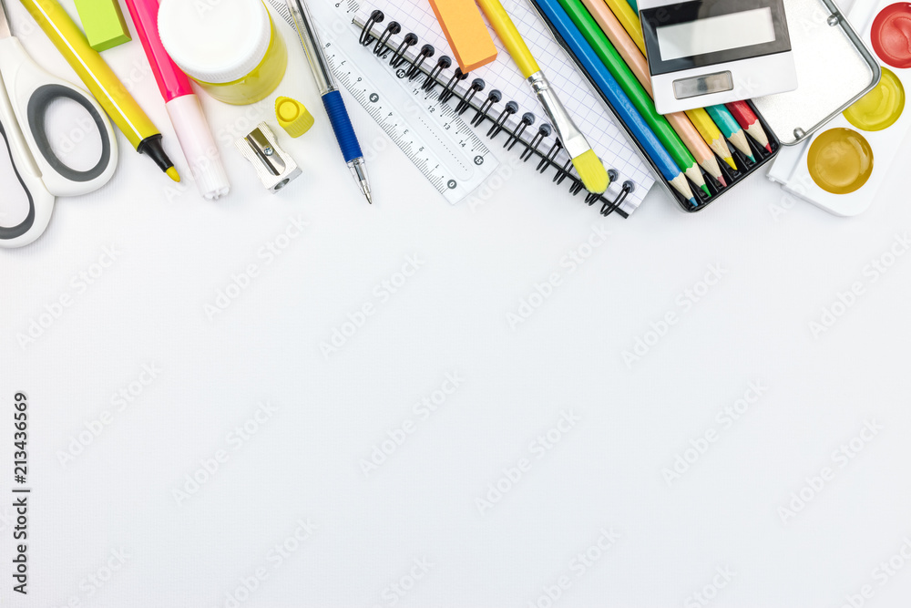 school stationary and tools for kids. pencils, paints, notebooks on white background, flat view