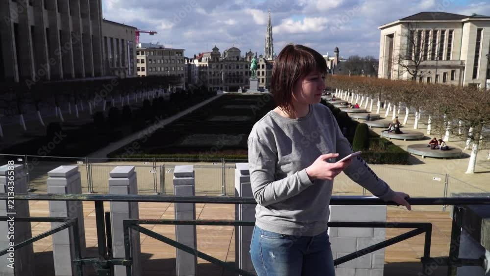 tourist lady looks at attractions in the city of Brussels Belgium tourist lady looks at attractions in the city of Brussels Belgium