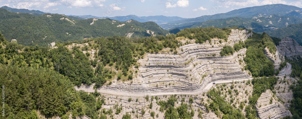 Italy. Scenic route to Mandrioli mountain pass. Landscape of walls made of sandstone and marl screeds named Scalacce. Tortuous curves