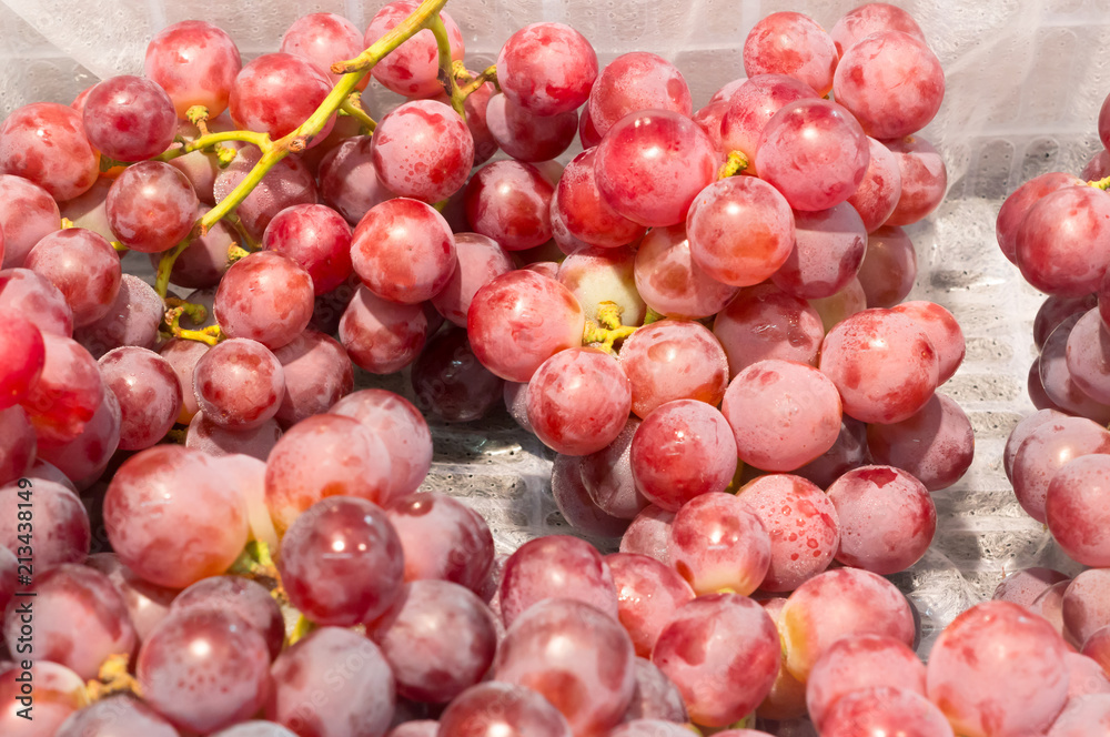 Ripe red grapes on sale in supermarket