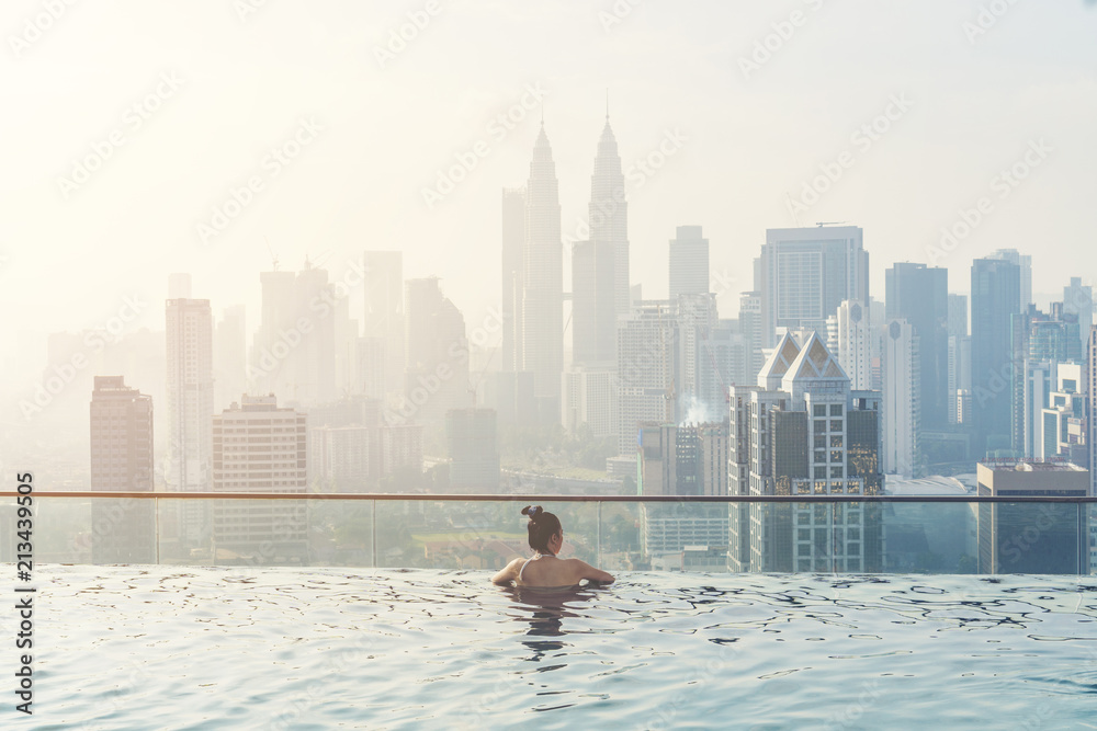 Fototapeta premium Swimming pool on roof top with beautiful city view kuala lumpur malaysia