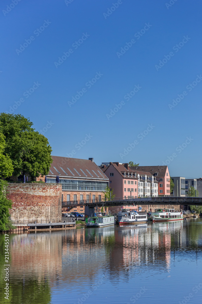 Colorful buildings and ships at the Fulda river quay in Kassel, Germany