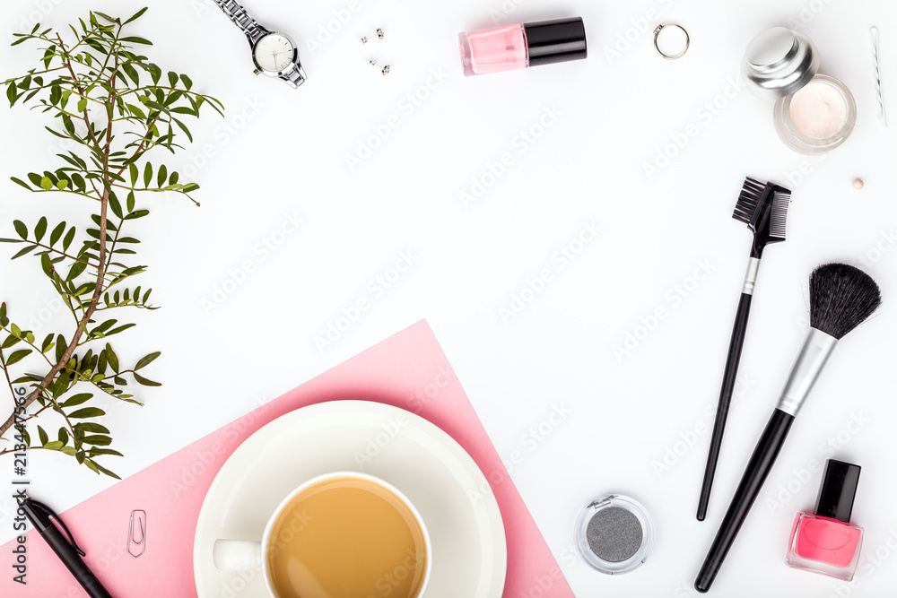 beauty and fashion blog or online shop concept. professional decorative  cosmetics, makeup tools, accessory and coffee mug on white background with  copy space. flat lay frame composition, top view Stock Photo
