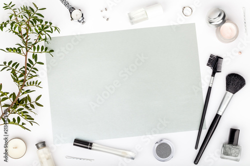 beauty and fashion blog or online shop concept. professional decorative cosmetics, makeup tools and accessory on white background with copy space for text. flat lay frame composition, top view