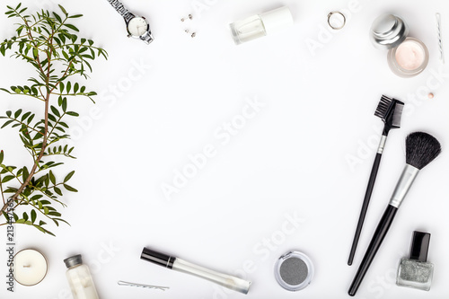 beauty and fashion blog or online shop concept. professional decorative cosmetics, makeup tools and accessory on white background with copy space for text. flat lay frame composition, top view