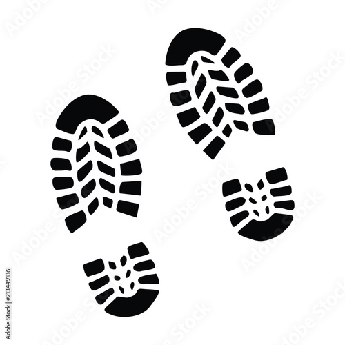 A black and white silhouette of some boot prints photo