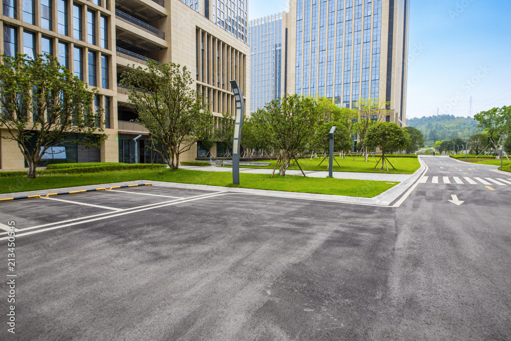 Outdoor parking lots and modern urban buildings Outdoor parking lots and modern urban buildings