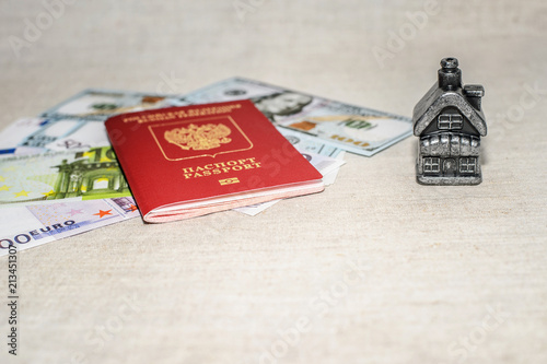 Passport, money and home - the concept of buying a property photo