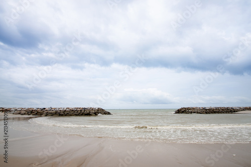 The beach with protect of wall rock for protect sea wave.