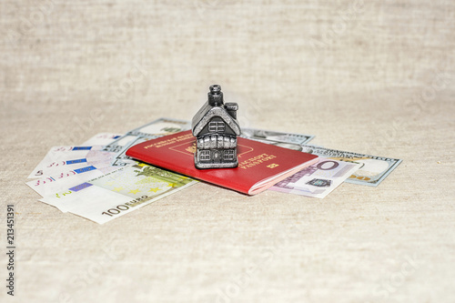 Passport, money and home - the concept of buying a property photo