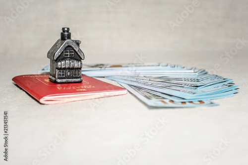 Passport, money and home - the concept of buying a property photo