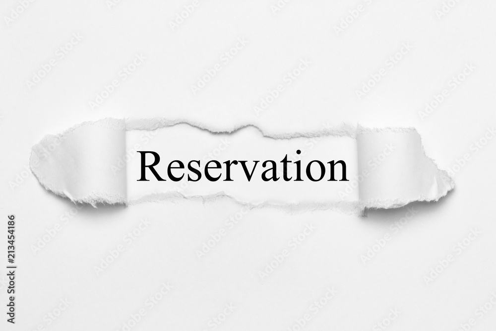 Reservation on white torn paper Reservation on white torn paper