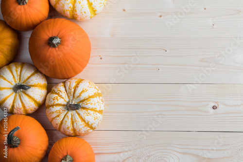 Pumpkins on wooden background