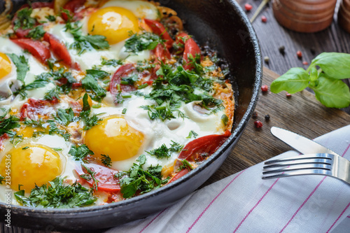 Freshly cooked fried eggs in a frying pan for breakfast