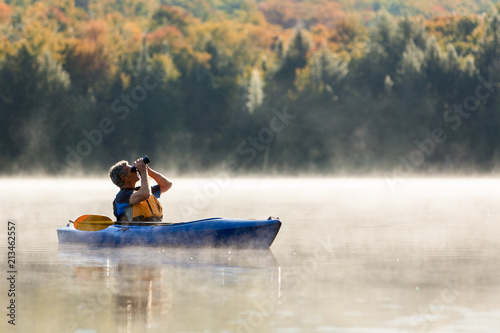 Wallpaper Mural Senior Man Solo Travel Birdwatching from Kayak on Foggy Morning Torontodigital.ca