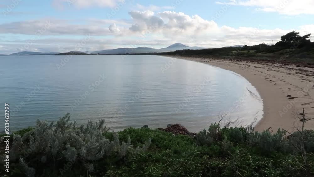 A small bay with gentle waves and a perfect sandy beach A small bay with gentle waves and a perfect sandy beach