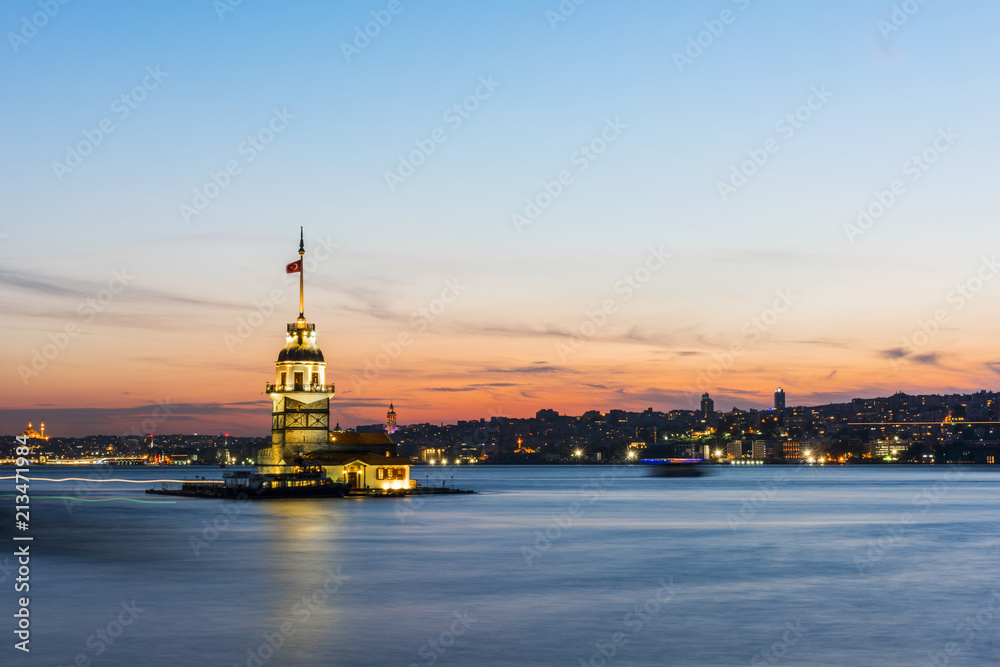 Romantic Istanbul Sunset Landscape. Istanbul Bosphorus and Maiden's Tower view with beautiful blue romantic sky. Istanbul, Turkey..