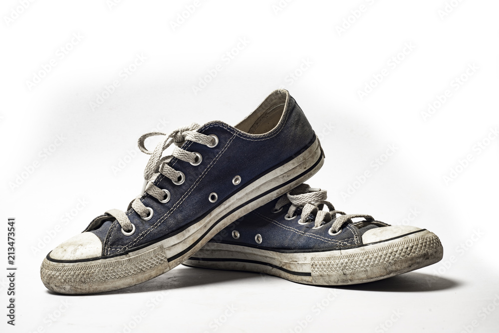 Dirty trainer canvas shoe on white background Dirty trainer canvas shoe on white background