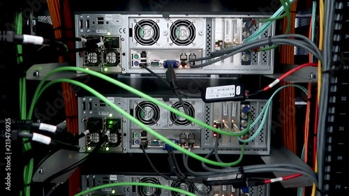 Back panel of powerful servers installed in the rack of the server room of the data center