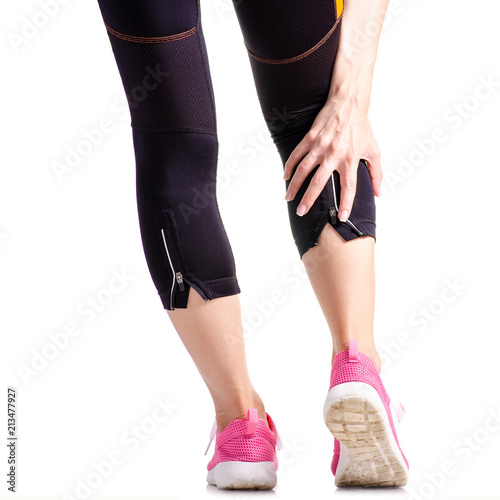 Female legs sports leggings sneakers sports exercises on a white background isolation