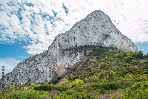 Mount Ifach in Calpe in Valencia, Spain, Europe. El Peñón de Ifach. In the background the sky with picturesque clouds.