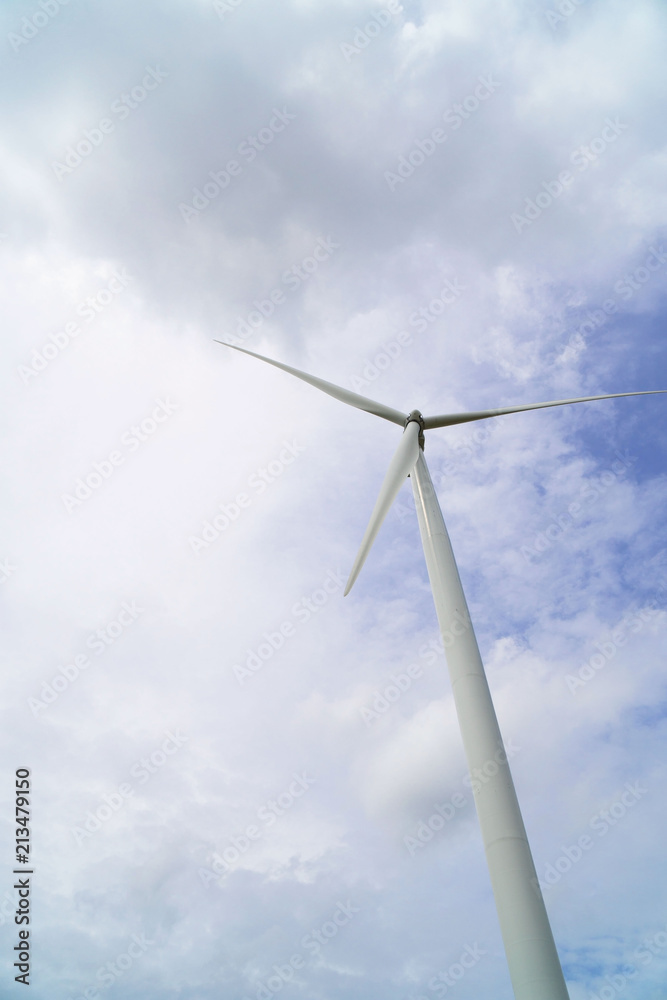 Wind turbines generating electricity on blue sky background .Eco power . Wind turbines generating electricity on blue sky background .Eco power .