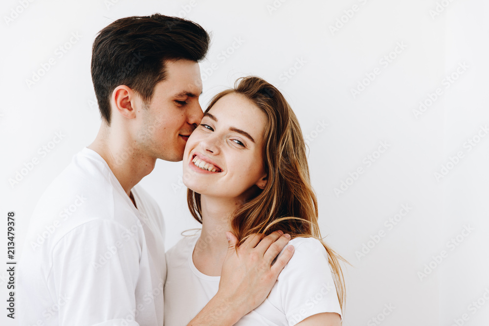 Kiss with love, Young Couple together against white background with Copy Space Kiss with love, Young Couple together against white background with Copy Space
