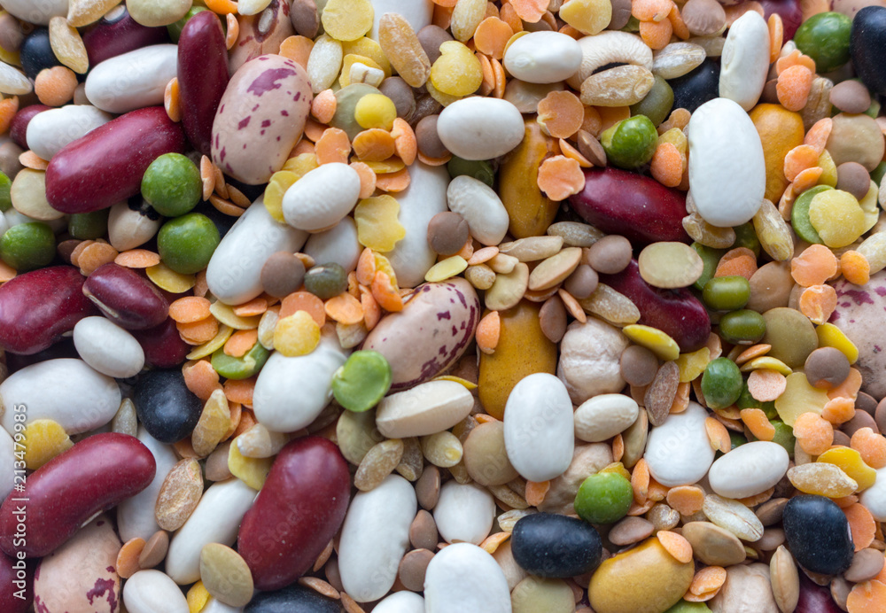 Mix of beans, peas, mung, lentil and kidney beans closeup. Organic healthy food. Vegeterian food concept. Mixed beans. Protein meal. Agriculture background. Mix of beans, peas, mung, lentil and kidney beans closeup. Organic healthy food. Vegeterian food concept. Mixed beans. Protein meal. Agriculture background.