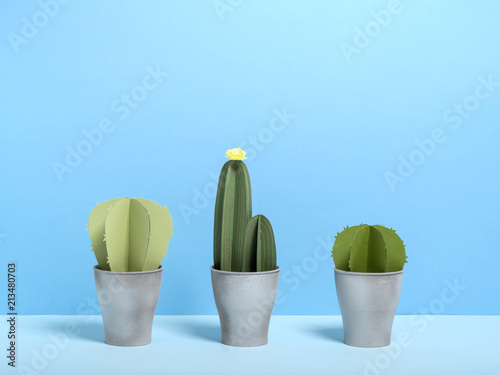 Set of paper green cactuses in pot. photo