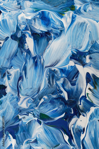 Cloeup of brushwork in blue and white tones, with acrylic paints