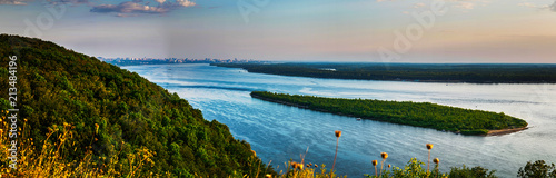 Panoramic view on Volga river and island with green forest during summer sunset from hill near Samara city photo