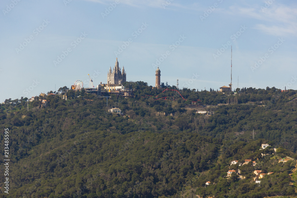 Views of Church Sacred Heart of Jesus on top of Tibidabo mountain in Barcelona. Tourist attraction, iconic landmark concepts