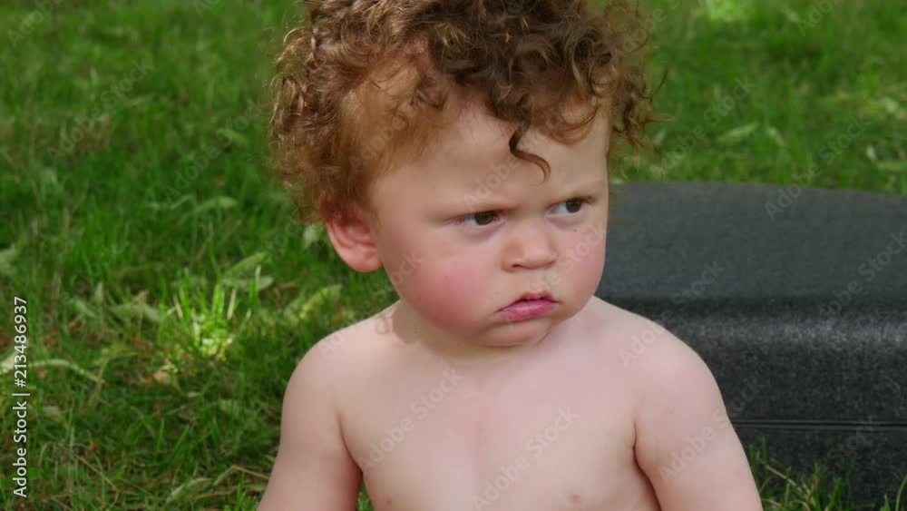 portrait of a little boy with curly hairs, outdoors portrait of a little boy with curly hairs, outdoors