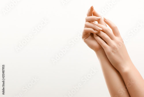 Beautiful Woman Hands. Female Hands Applying Cream, Lotion. Spa and Manicure concept. Female hands with french manicure. Soft skin, skincare concept. Hand Skin Care.