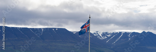 Flag of Iceland against the background of mountains