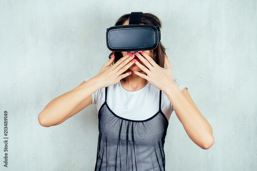 Indian girl with virtual reality glasses is very surprised Indian girl with virtual reality glasses is very surprised