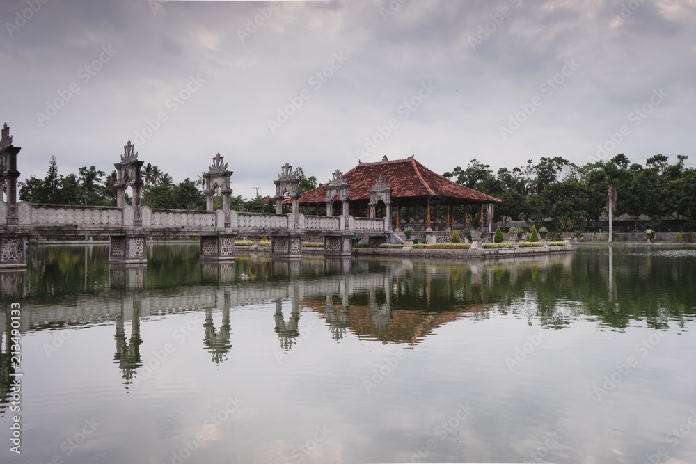 Bali, Indonesia: Panoramic view of building on lake shore with reflection in water