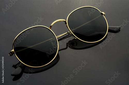 round sunglasses isolated on black