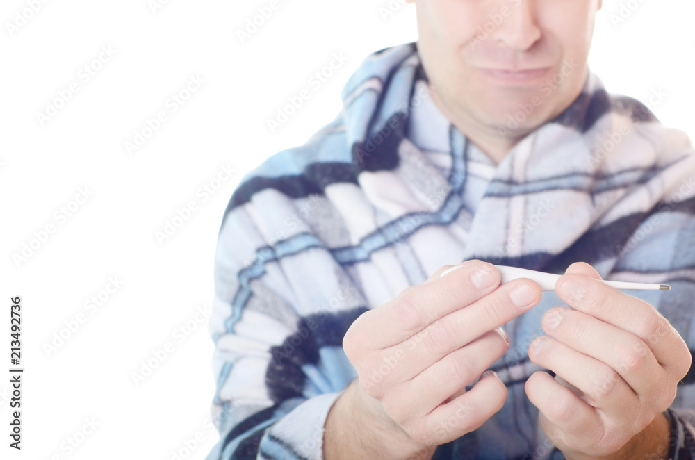 Fototapeta premium Surprised unhappy Man in tartan read measurement result from digital thermometer