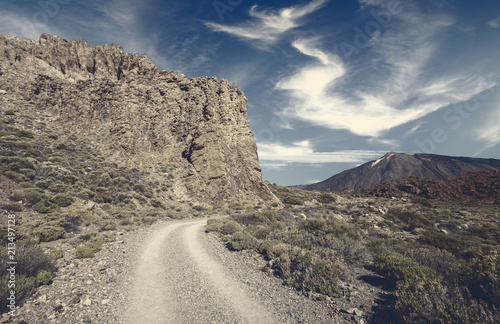 road through rocky desert around the volcano