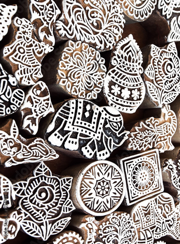 Small elephant and other symbols and patterns on wooden mold blocks for traditional printing textile. Design in India
