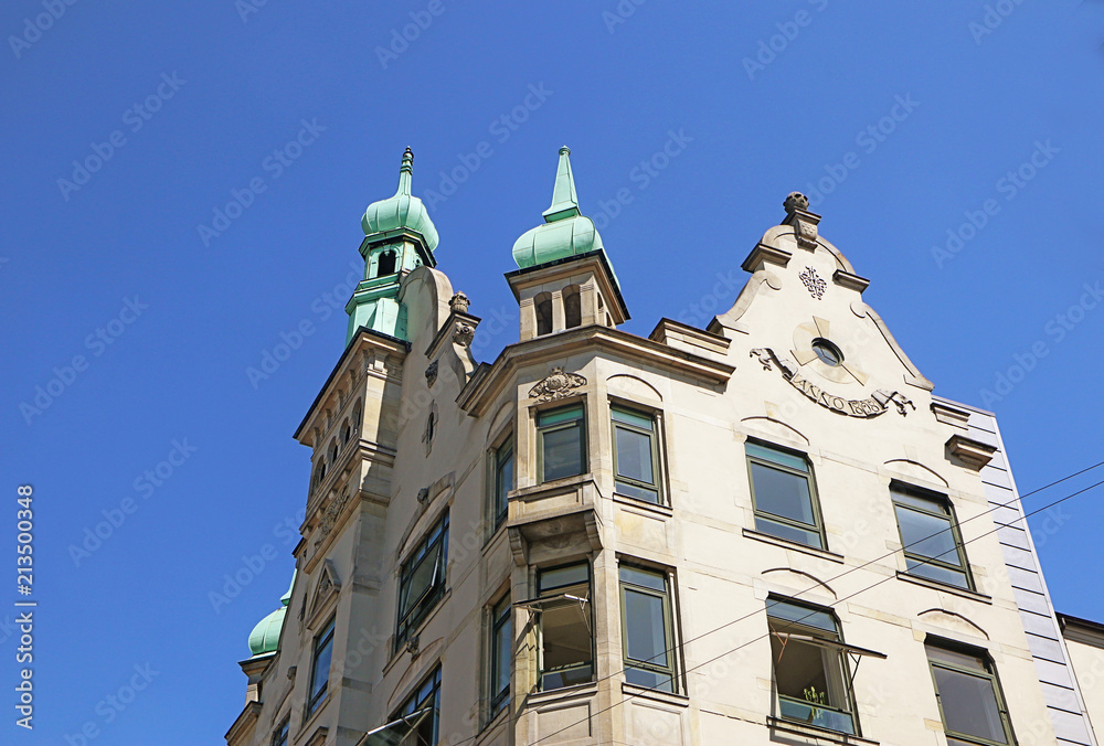 Copenhagen, Denmark - view of  the towers of an antique building  in city center  with the green copper decorated cover characteristic of the city profile