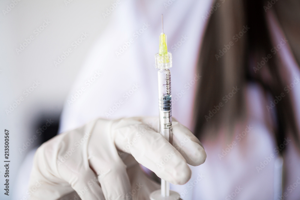 Syringe. Doctor Prepared Syringe of Vaccine to Injunction Patient Syringe. Doctor Prepared Syringe of Vaccine to Injunction Patient