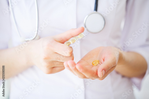 Closeup Of Woman Hands Holding Variety Of Colorful Vitamin Pills. Close-up Handful Of Medication, Medicine Tablets, Capsules. Healthy Diet Nutrition Concept. High Resolution