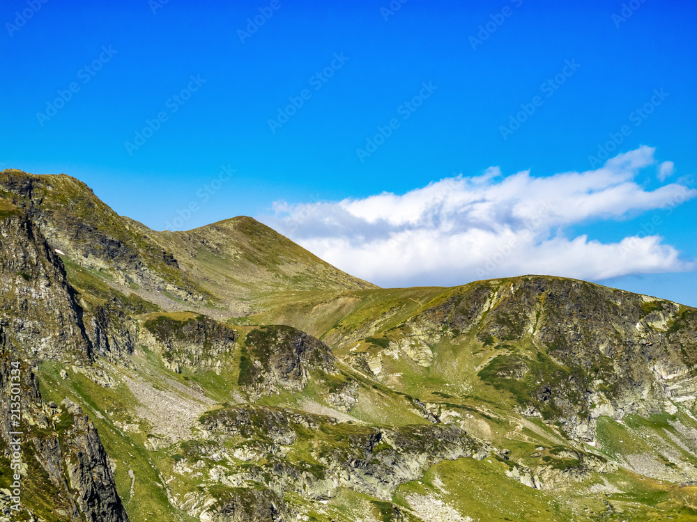 Beautiful view to Bulgarian Rila Mountains steep rocky slopes in summer