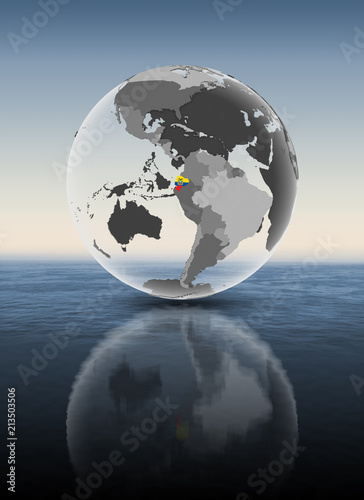 Ecuador on translucent globe above water